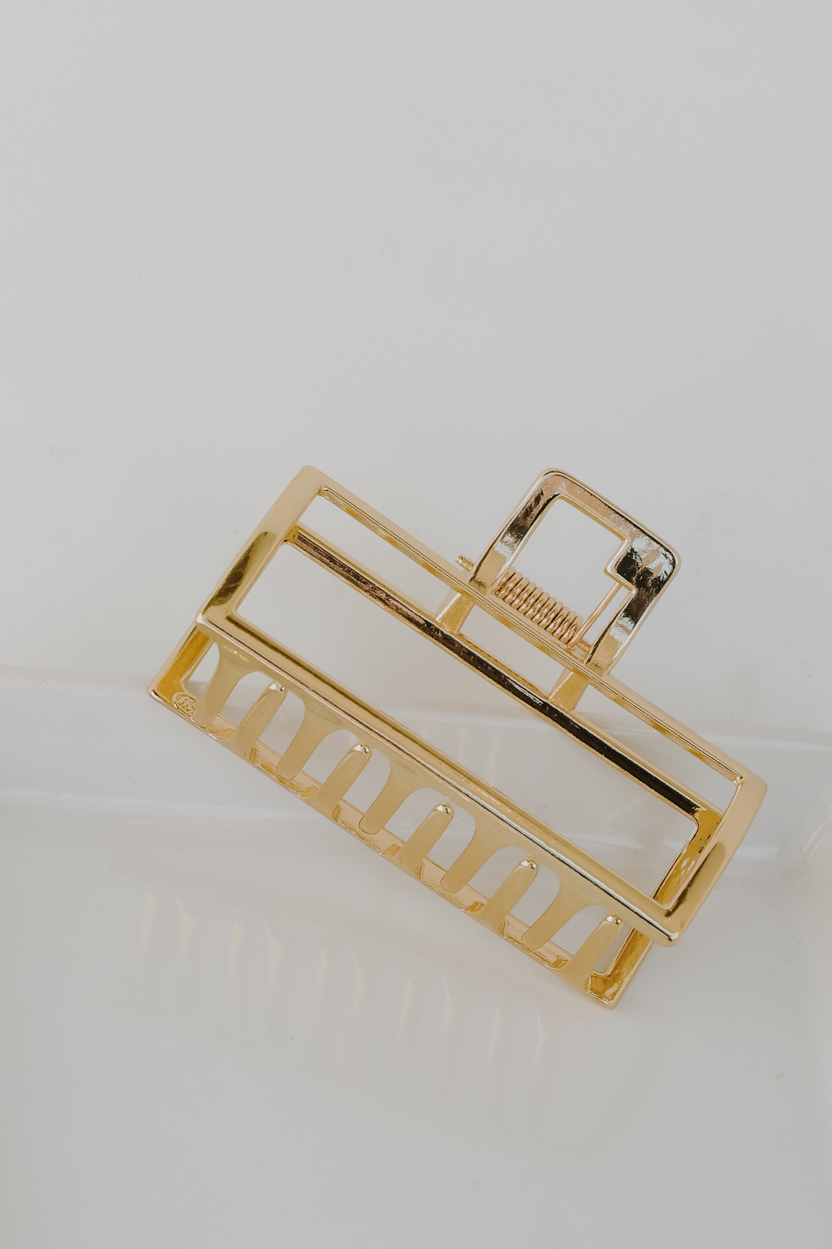 Gold Claw Hair Clip flat lay