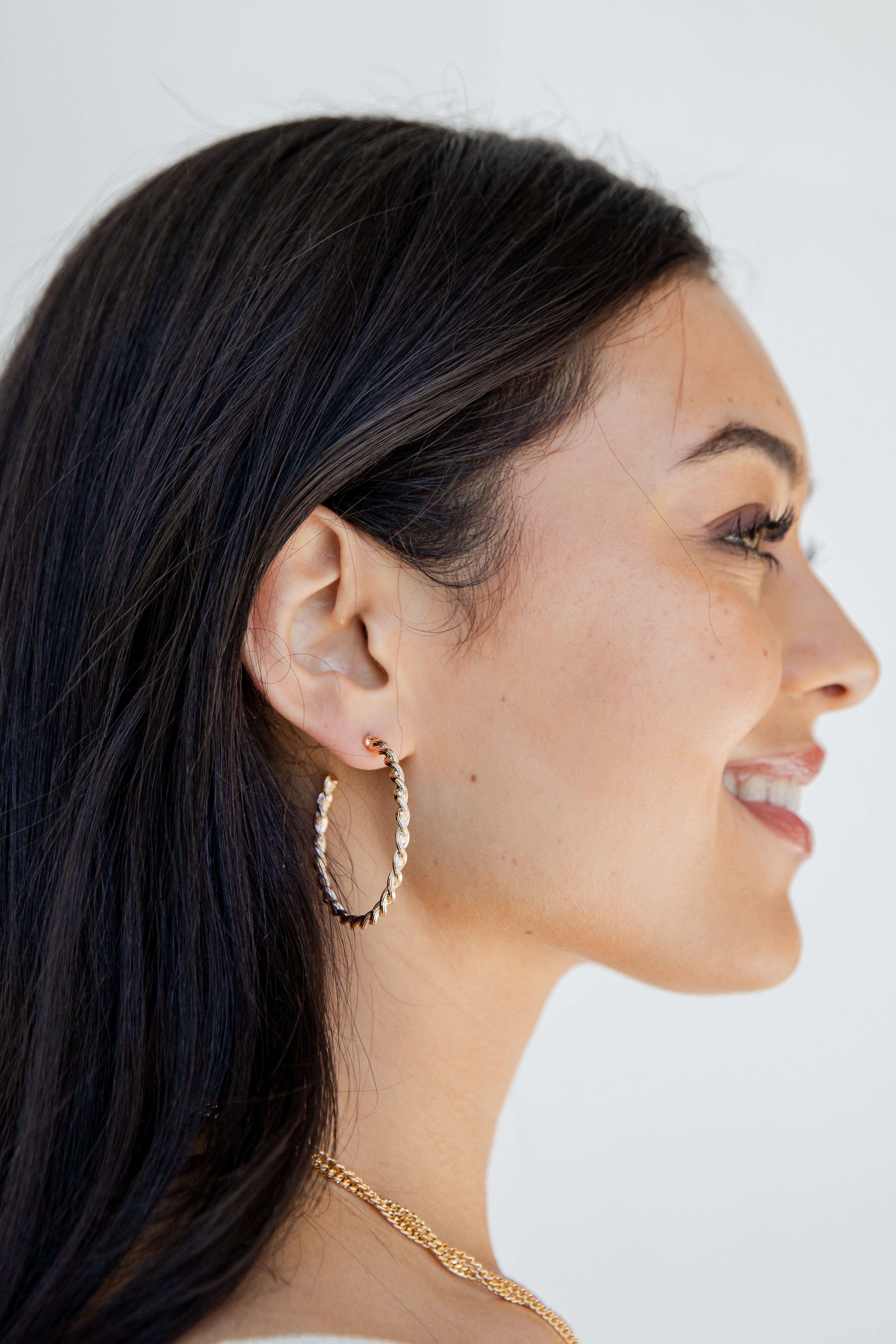 Gold Twisted Hoop Earrings on model