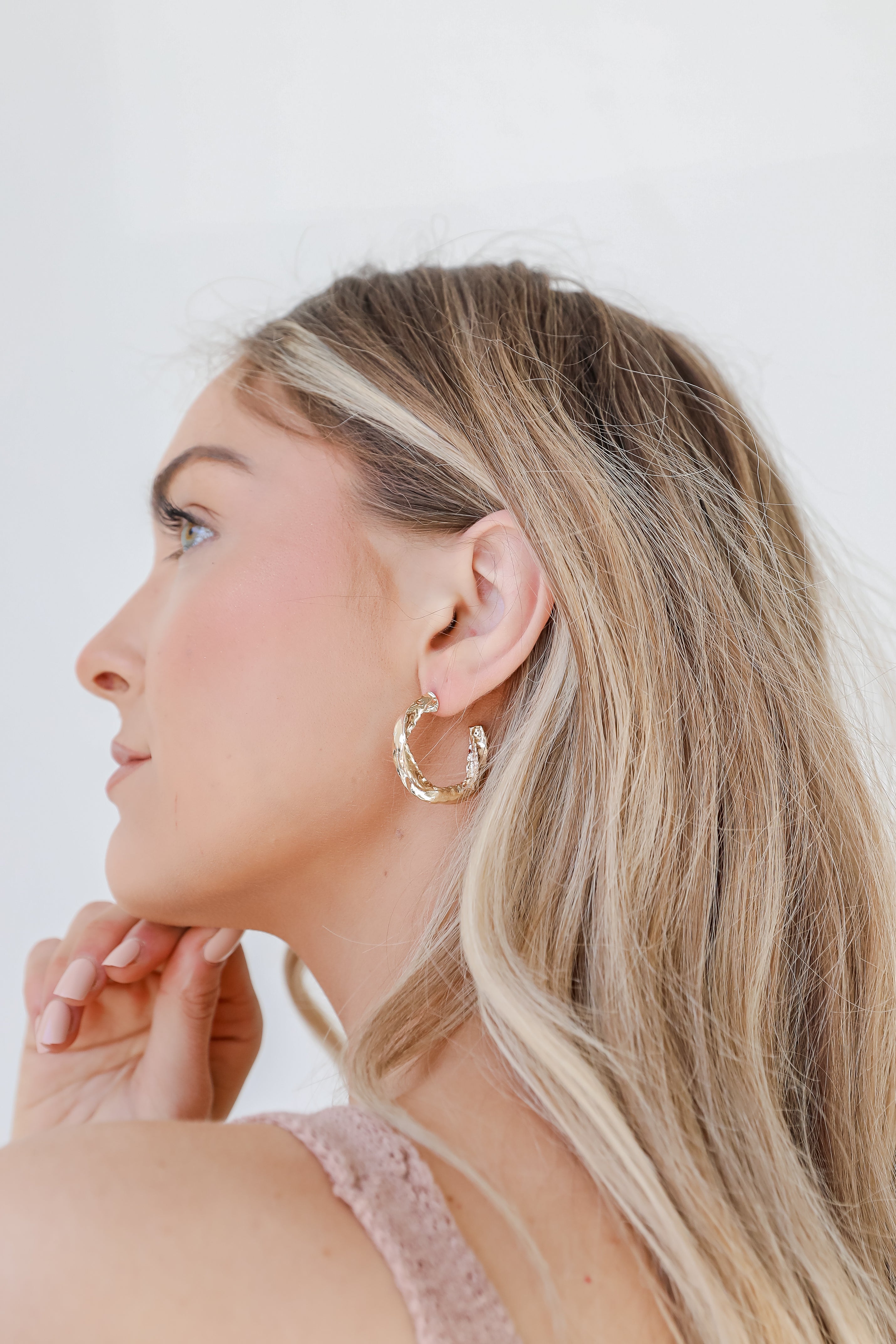 Gold Hammered Hoop Earrings on model