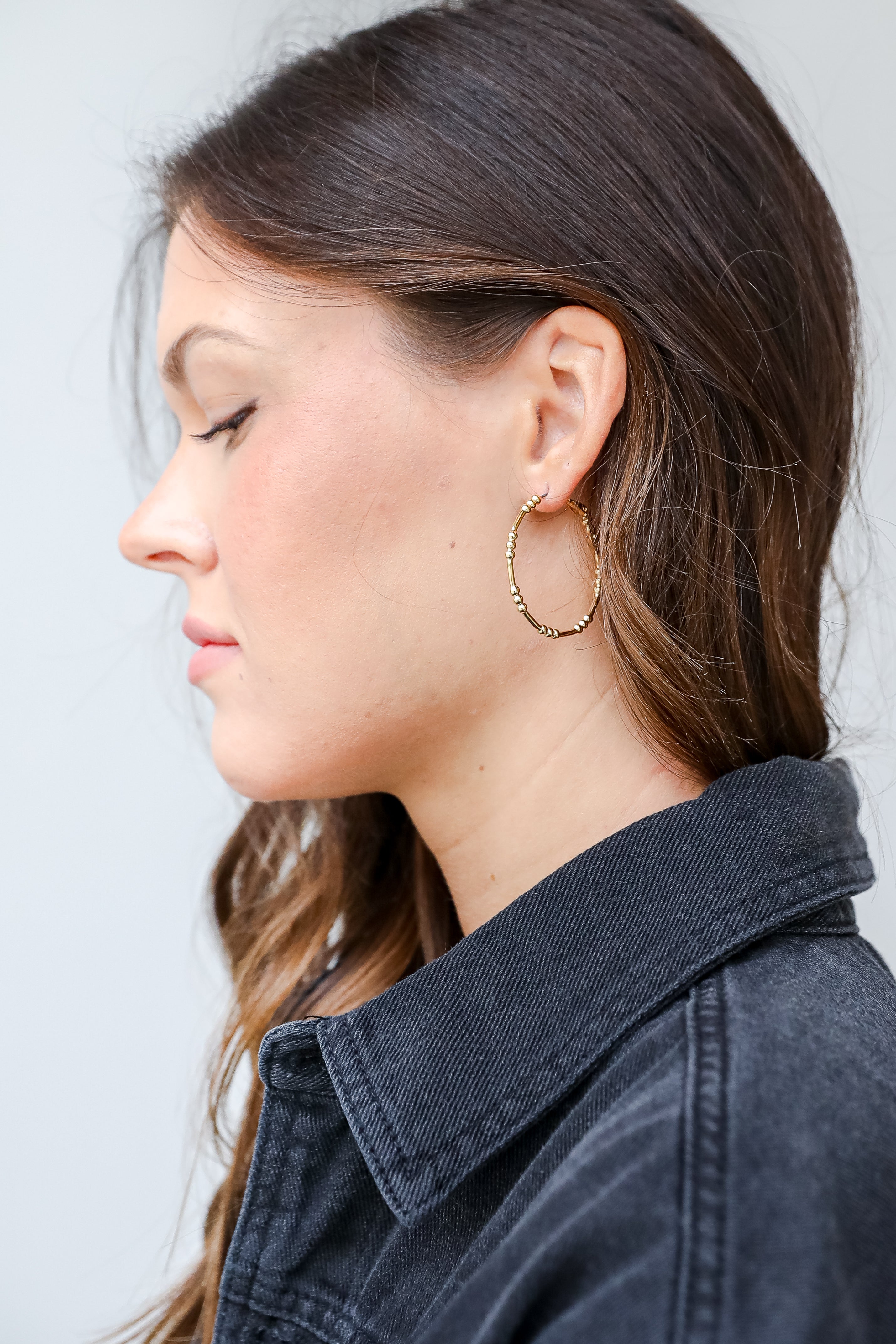 Gold Ball Hoop Earrings on model