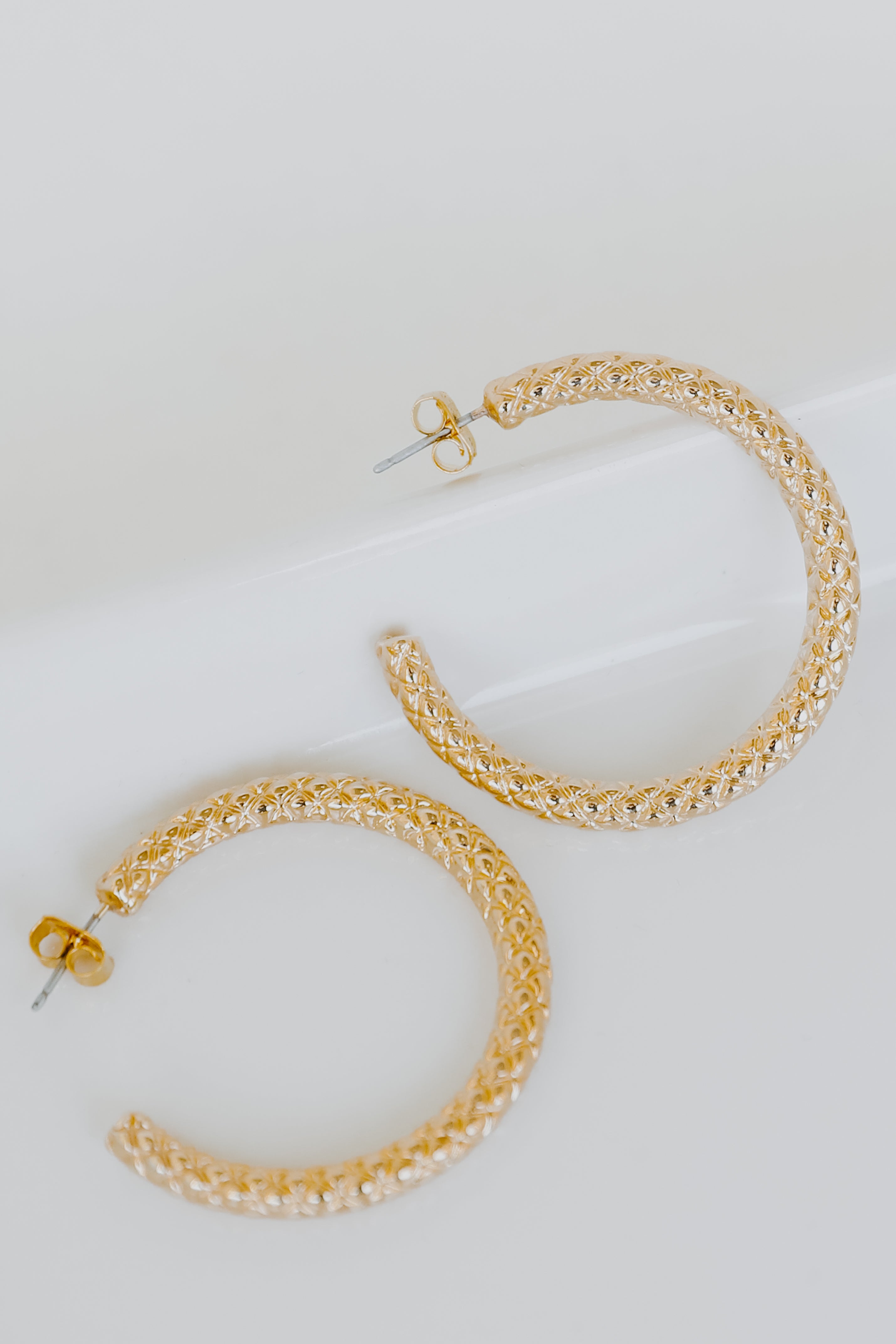 Gold Textured Hoop Earrings flat lay