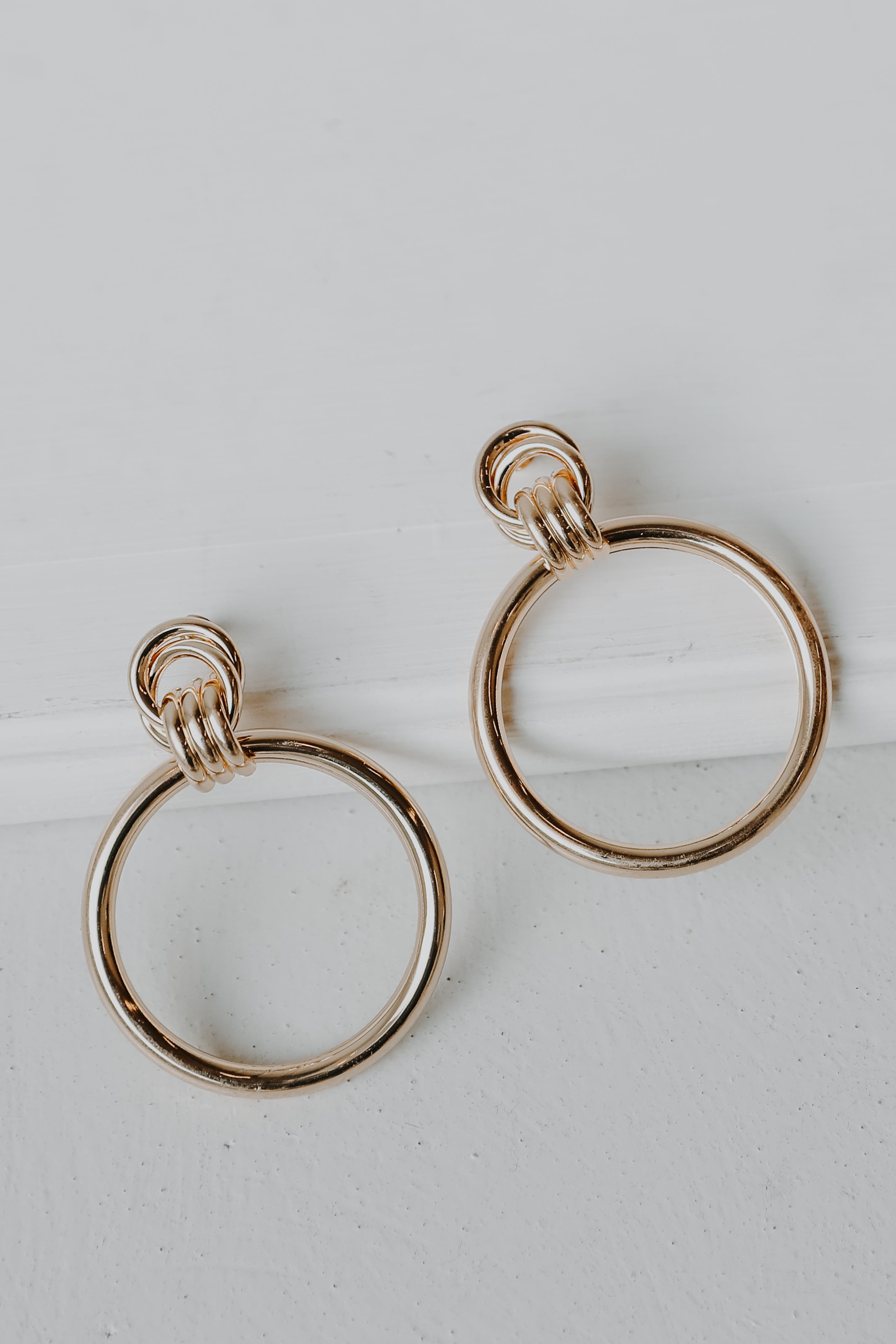 Gold Circle Statement Earrings flat lay