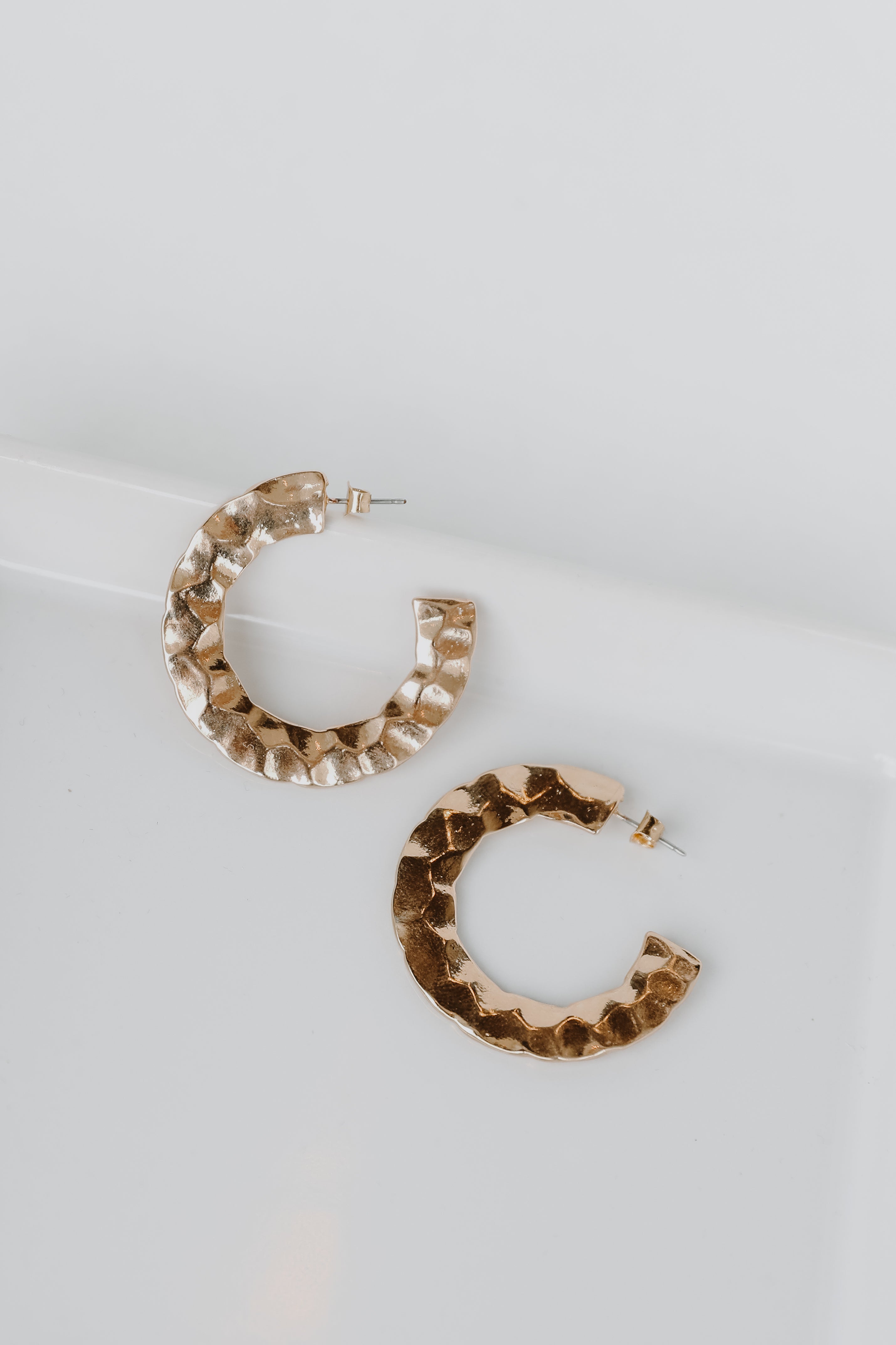 Gold Hammered Hoop Earrings flat lay