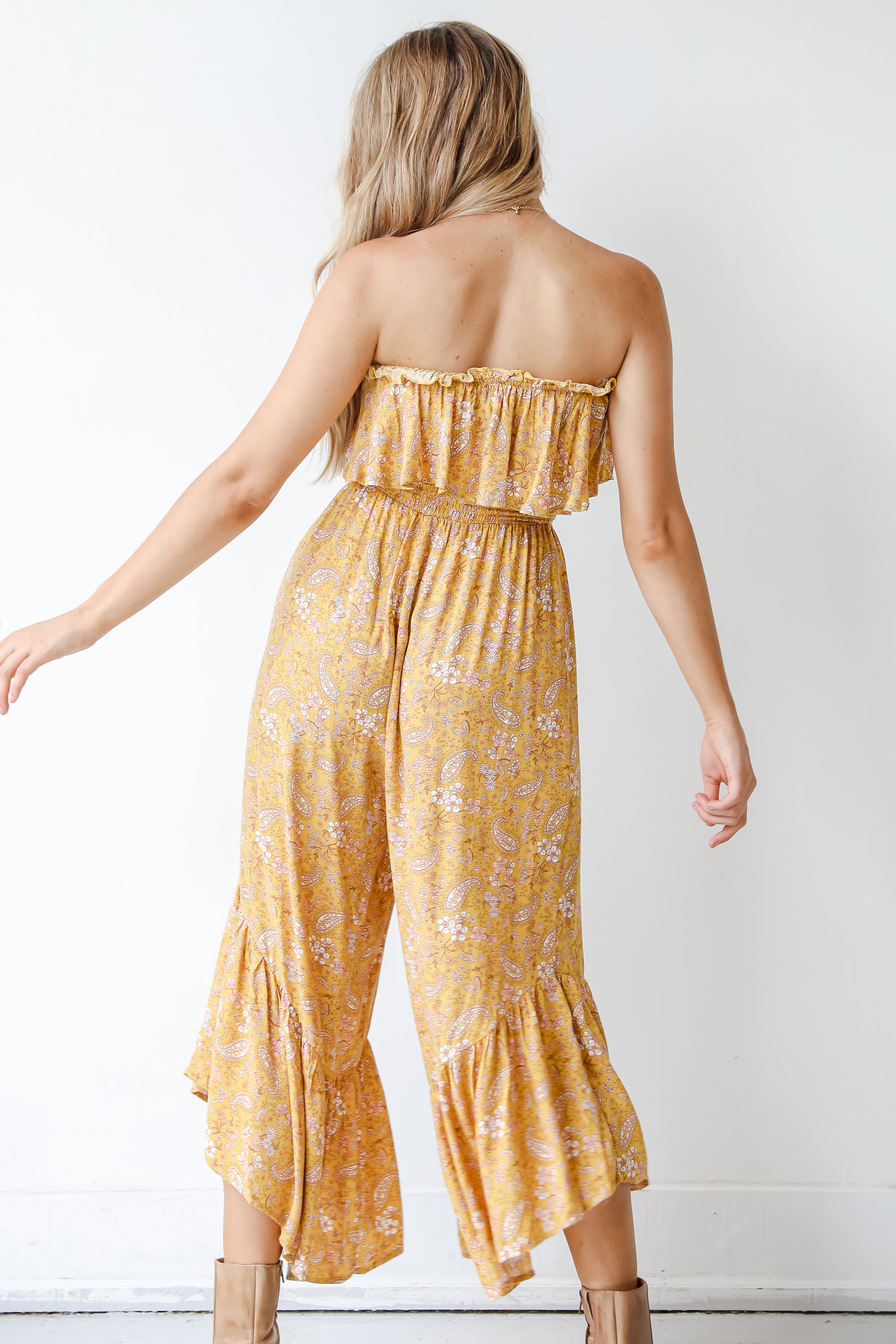 back view on model of a yellow jumpsuit