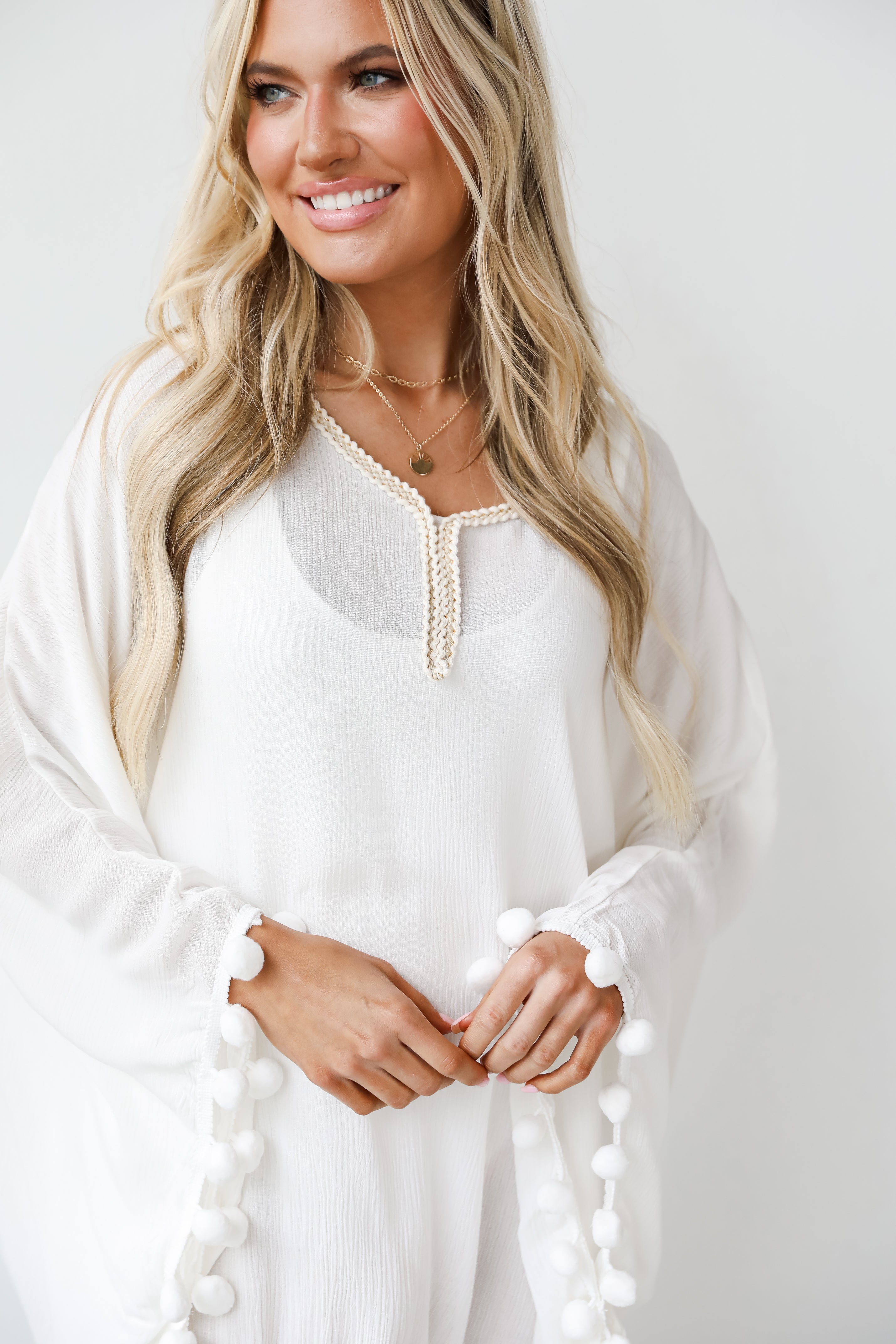 white Pom Pom Coverup close up