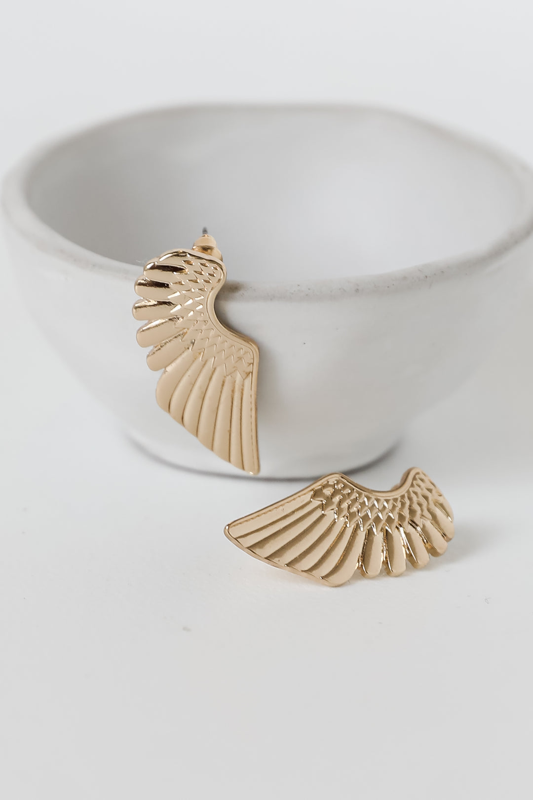 Gold Wing Earrings on model