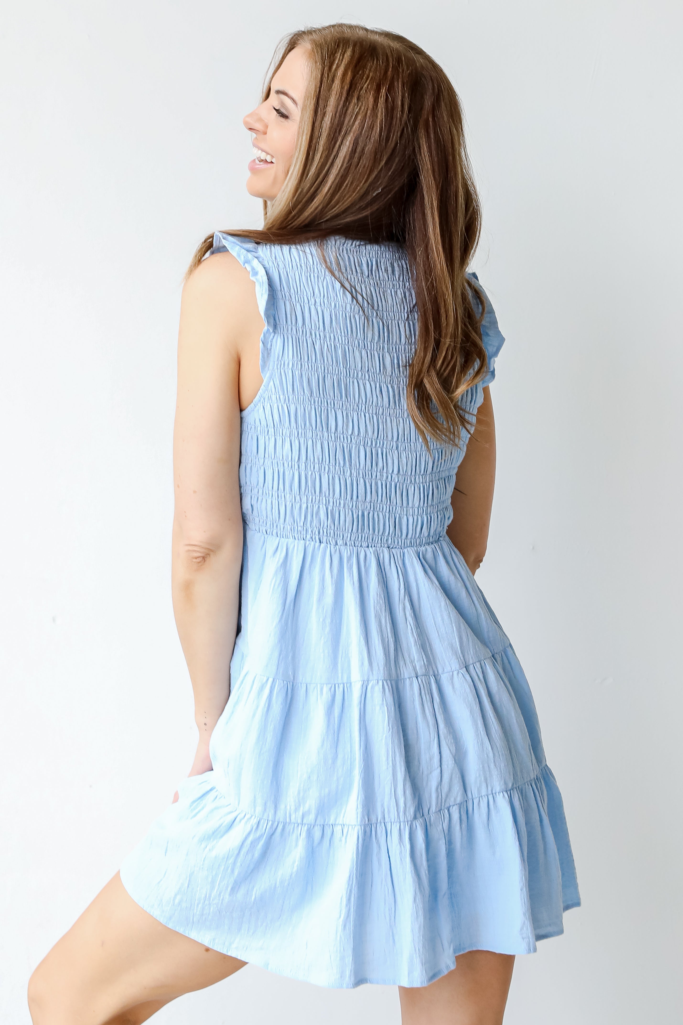 Smocked Tiered Mini Dress in blue back view