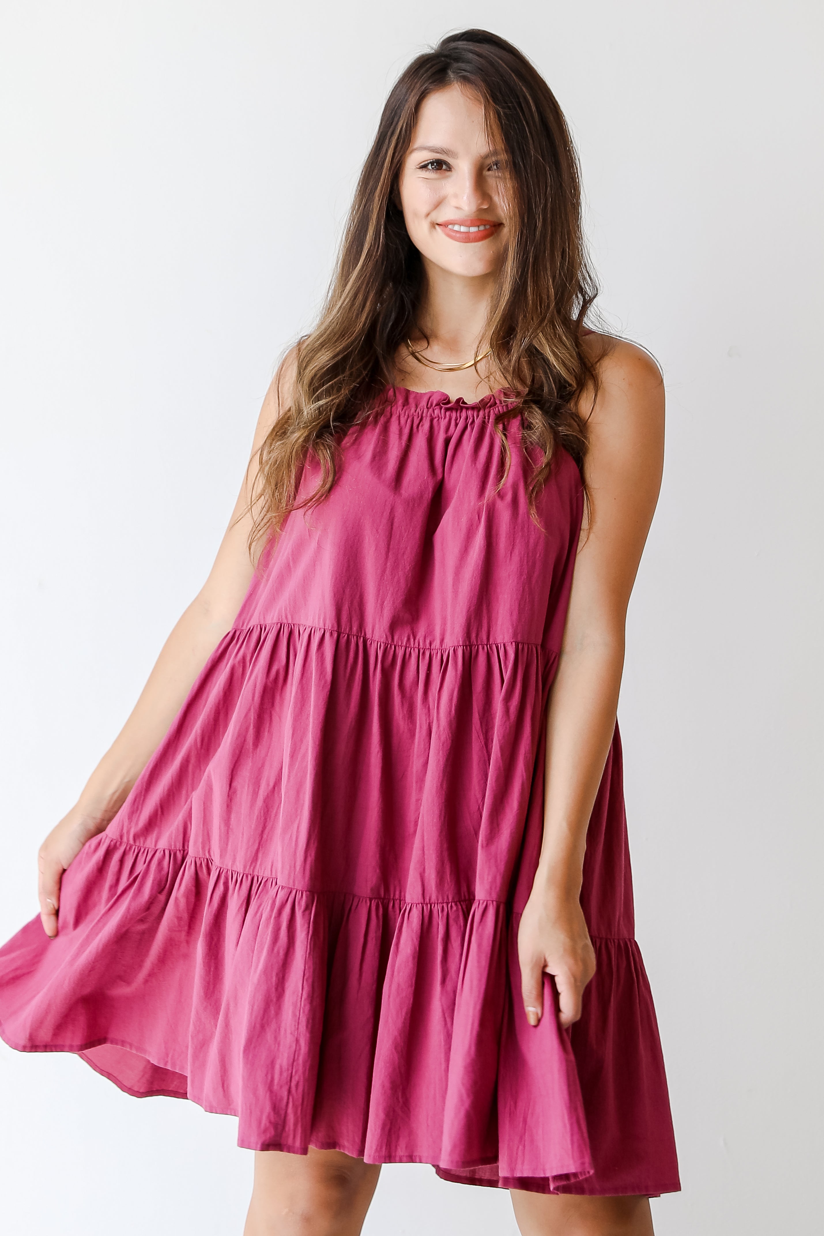 purple tiered mini dress on model