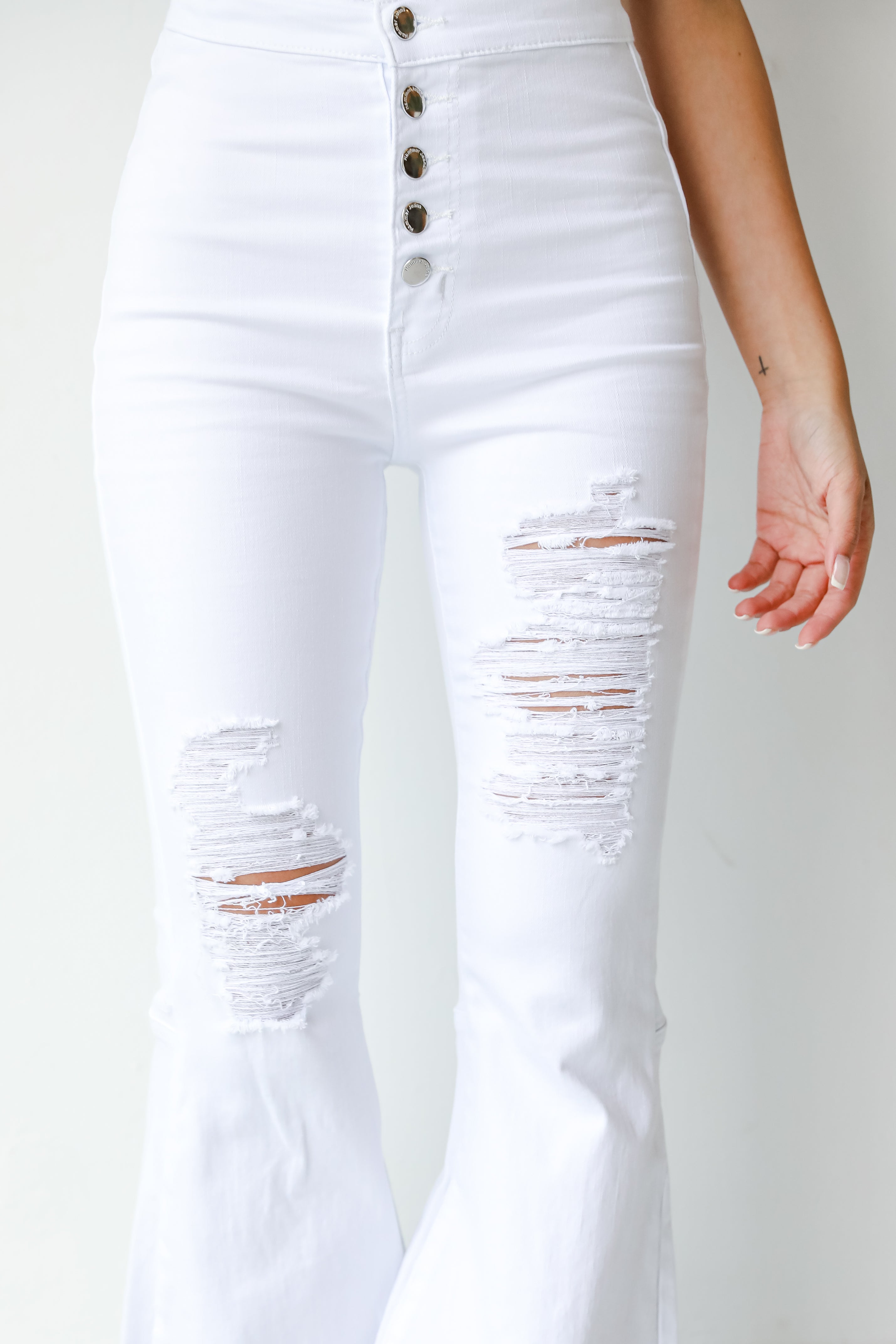 White Distressed Flare Jeans close up