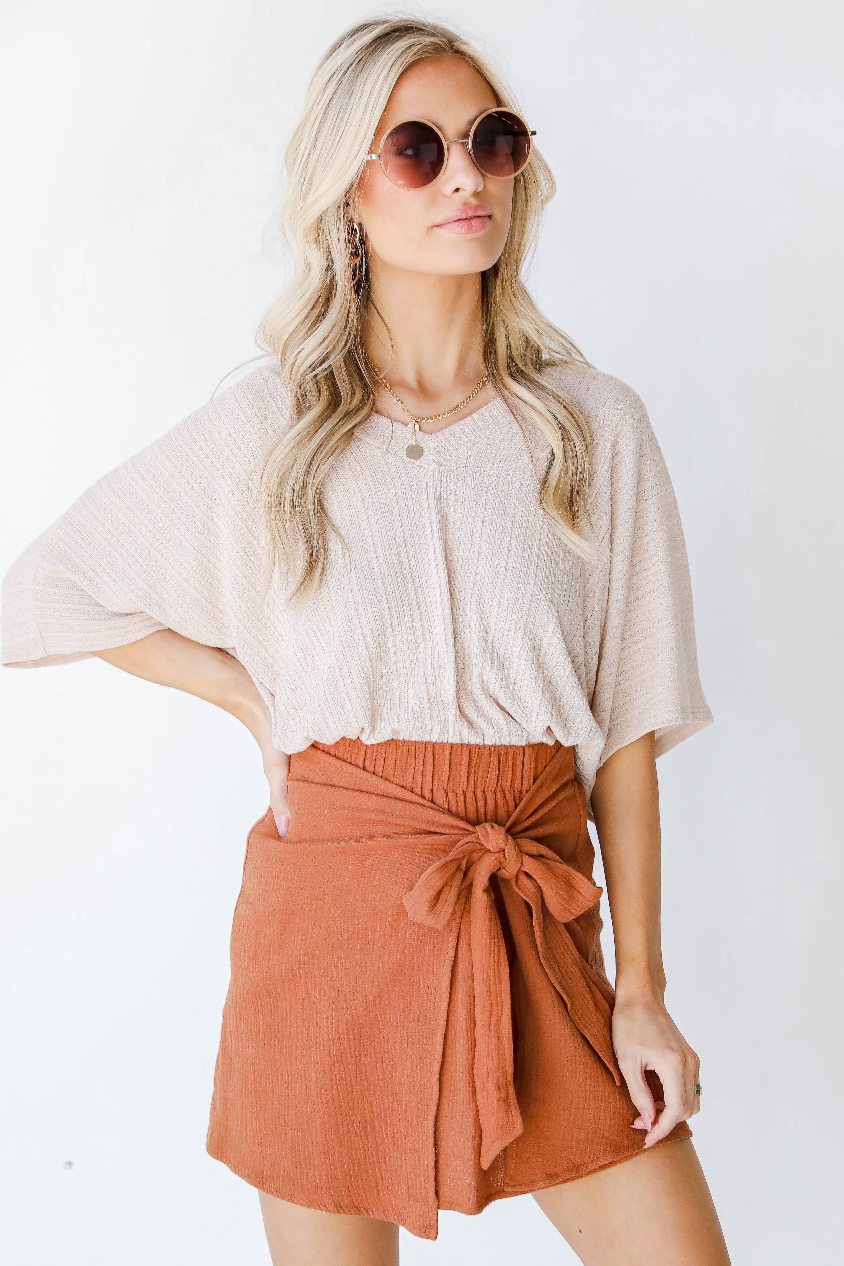 Wrap Mini Skirt in camel on model