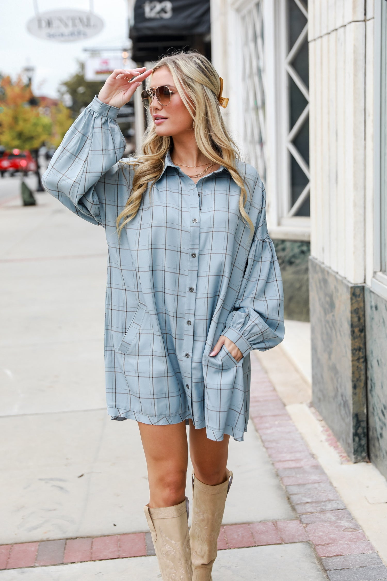 model wearing oversized flowy blue mini dress