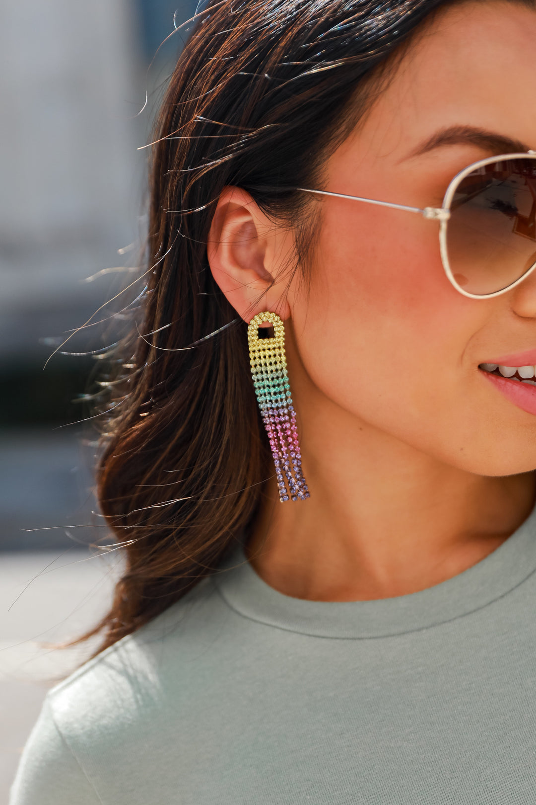 model wearing colorful rhinestone statement earrings