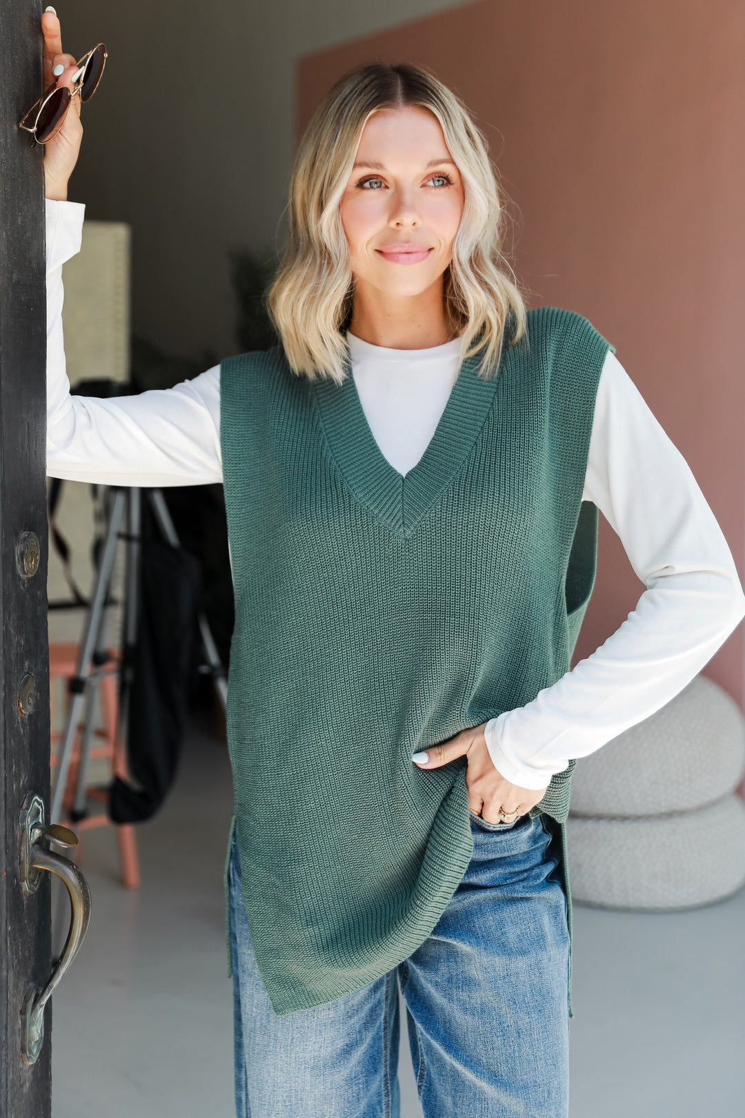 A variety of sweater vests in different colors and styles, showcasing versatile fashion options for fall and beyond.