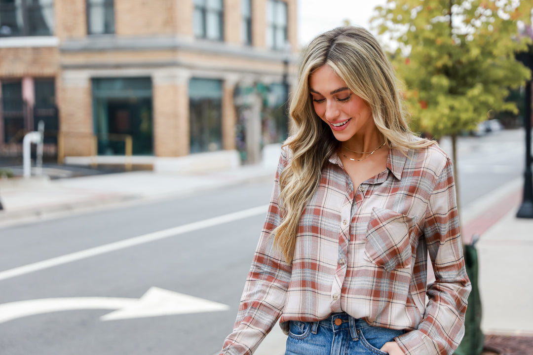 model wearing a neutral plaid flannel for fall