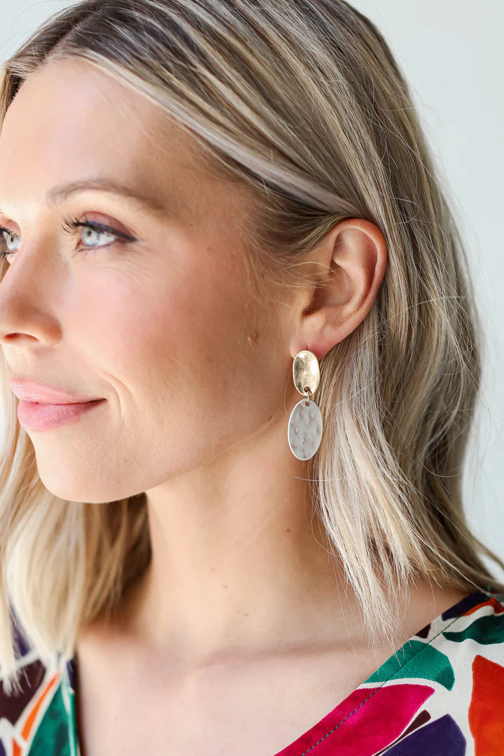 Close up of Dress Up model showcasing earrings