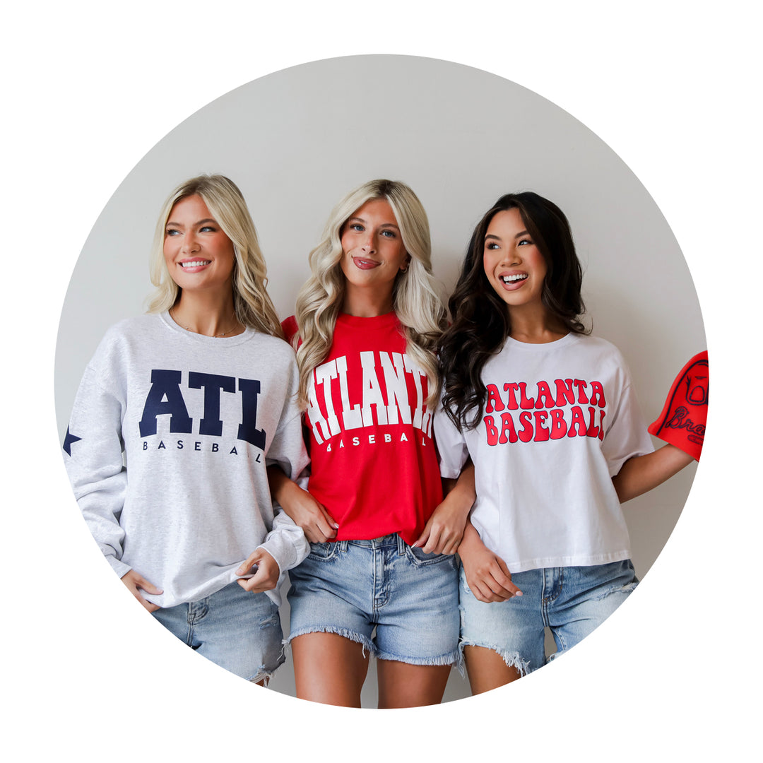 Two models wearing Atlanta baseball pullovers 