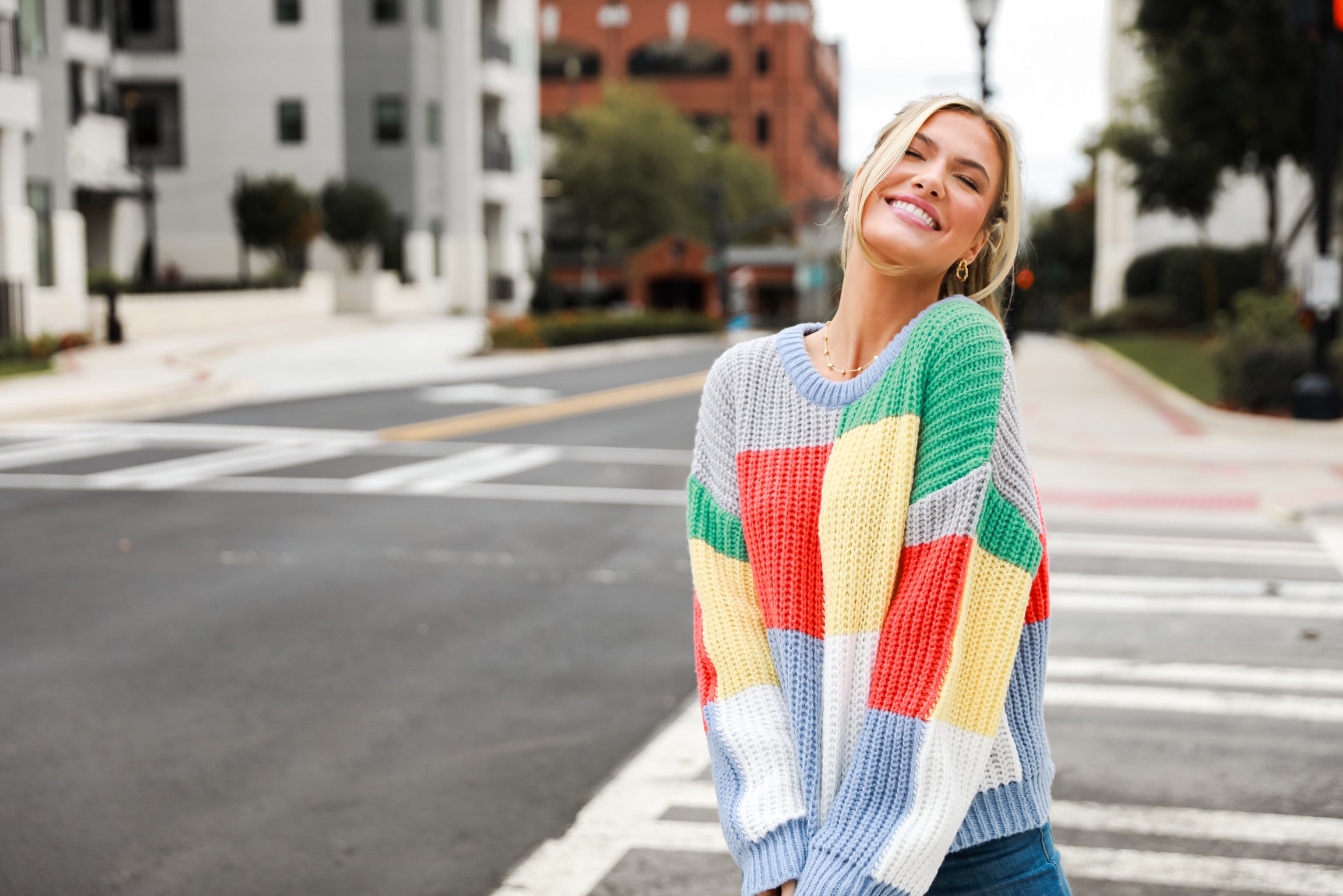 model wearing a colorful sweater