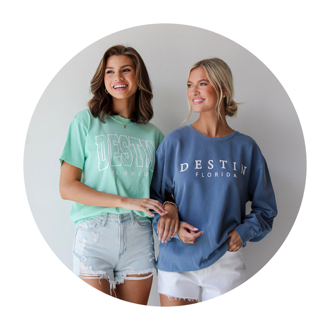 model wearing custom, exclusive comfort colors Destin, FL graphic tee + soft pullover