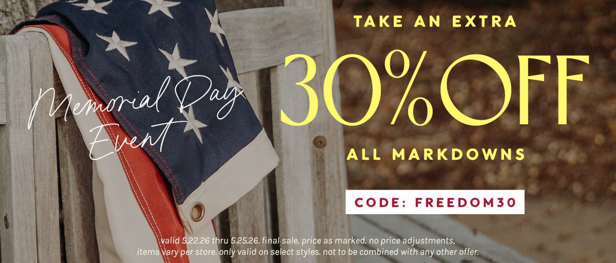 American flag draped over a wooden chair with Memorial Day sale text overlay