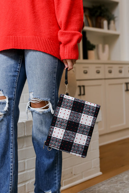 model holding a Black Plaid Crossbody Bag