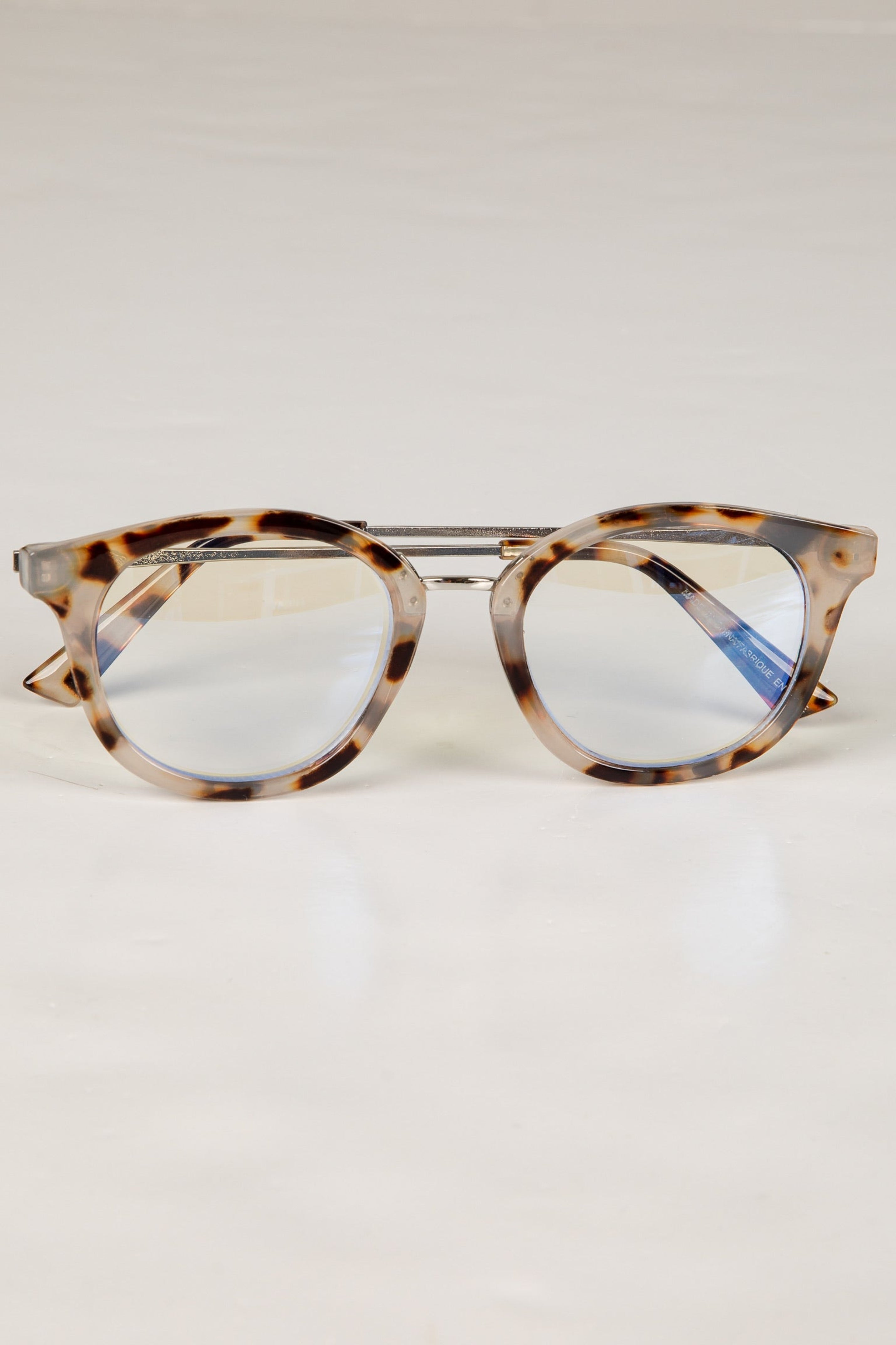 Tortoiseshell cat-eye glasses on a white background