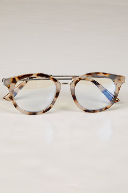 Tortoiseshell cat-eye glasses on a white background