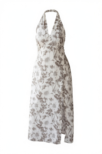 A halter-neck maxi dress with a brown and gray floral pattern on a white background, shown against a plain white studio backdrop.