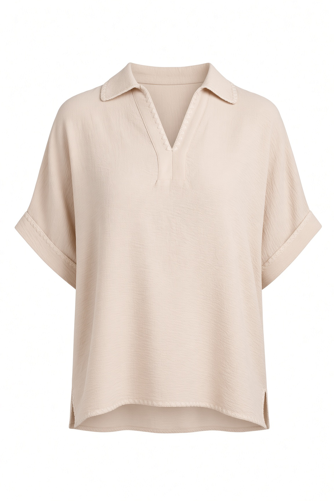 A light beige short-sleeve polo shirt with a relaxed fit, displayed on a clean white background.