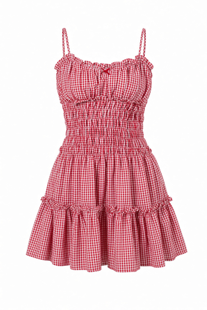Red and white gingham mini dress with a smocked bodice, ruffled spaghetti straps, and tiered skirt on a white background.