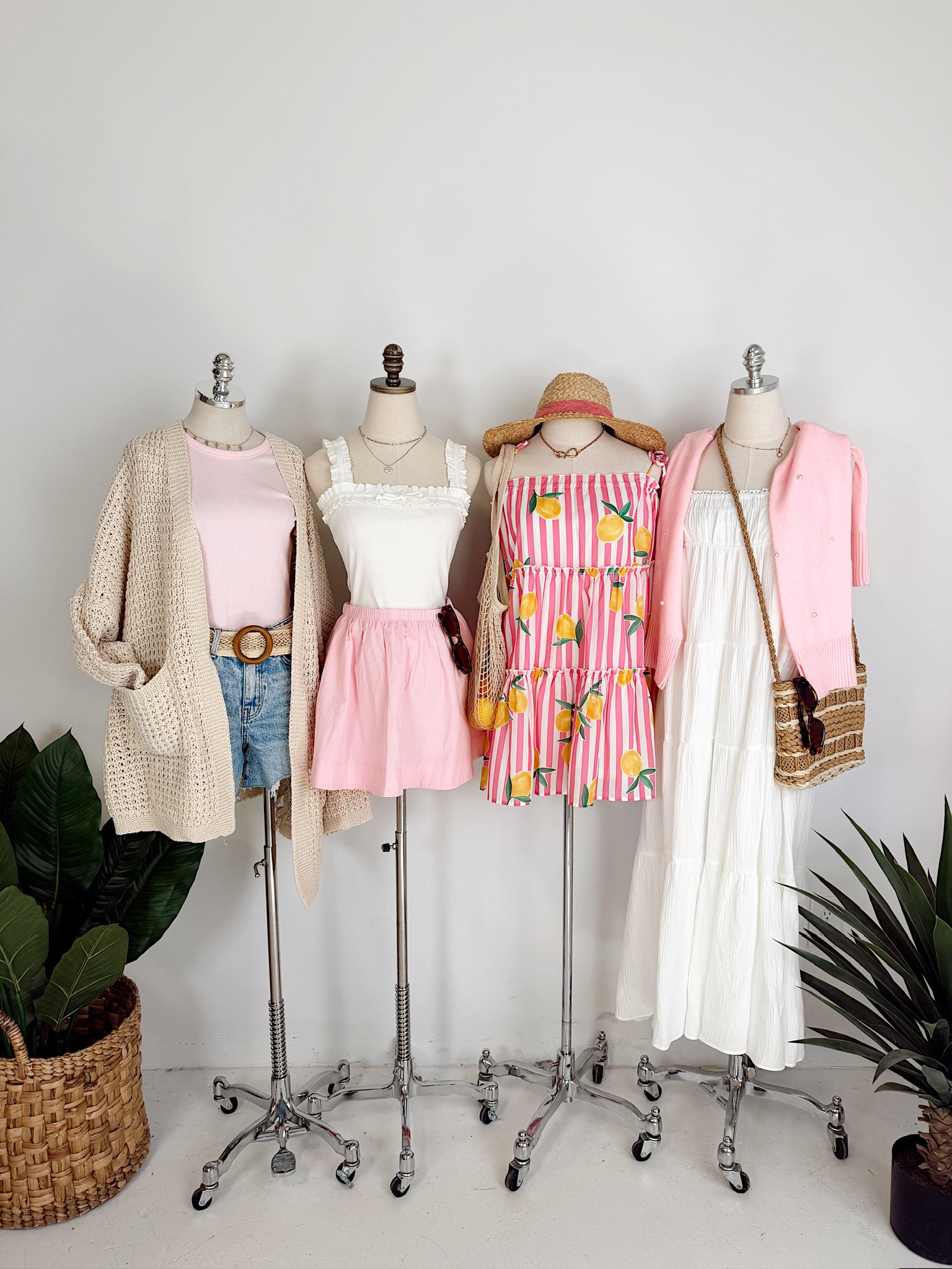 Mannequins with various outfits on a white background