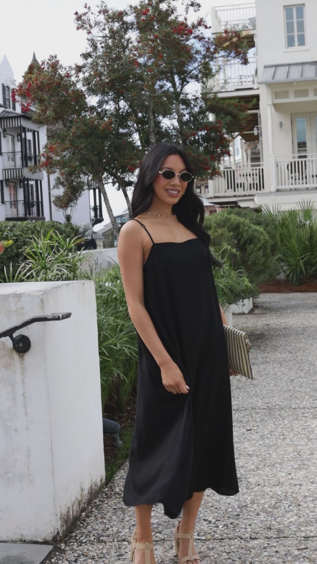 women in black midi dress