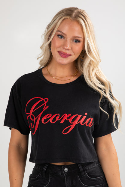 Woman wearing a black t-shirt with &