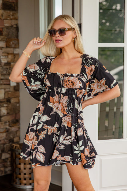 Woman wearing a floral dress with a blurred background