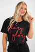 Woman wearing a black t-shirt with &
