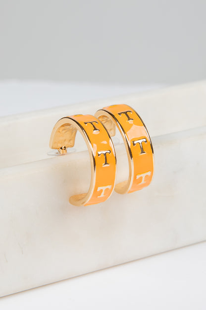 Pair of gold hoop earrings with &