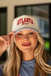Woman wearing a cap with &