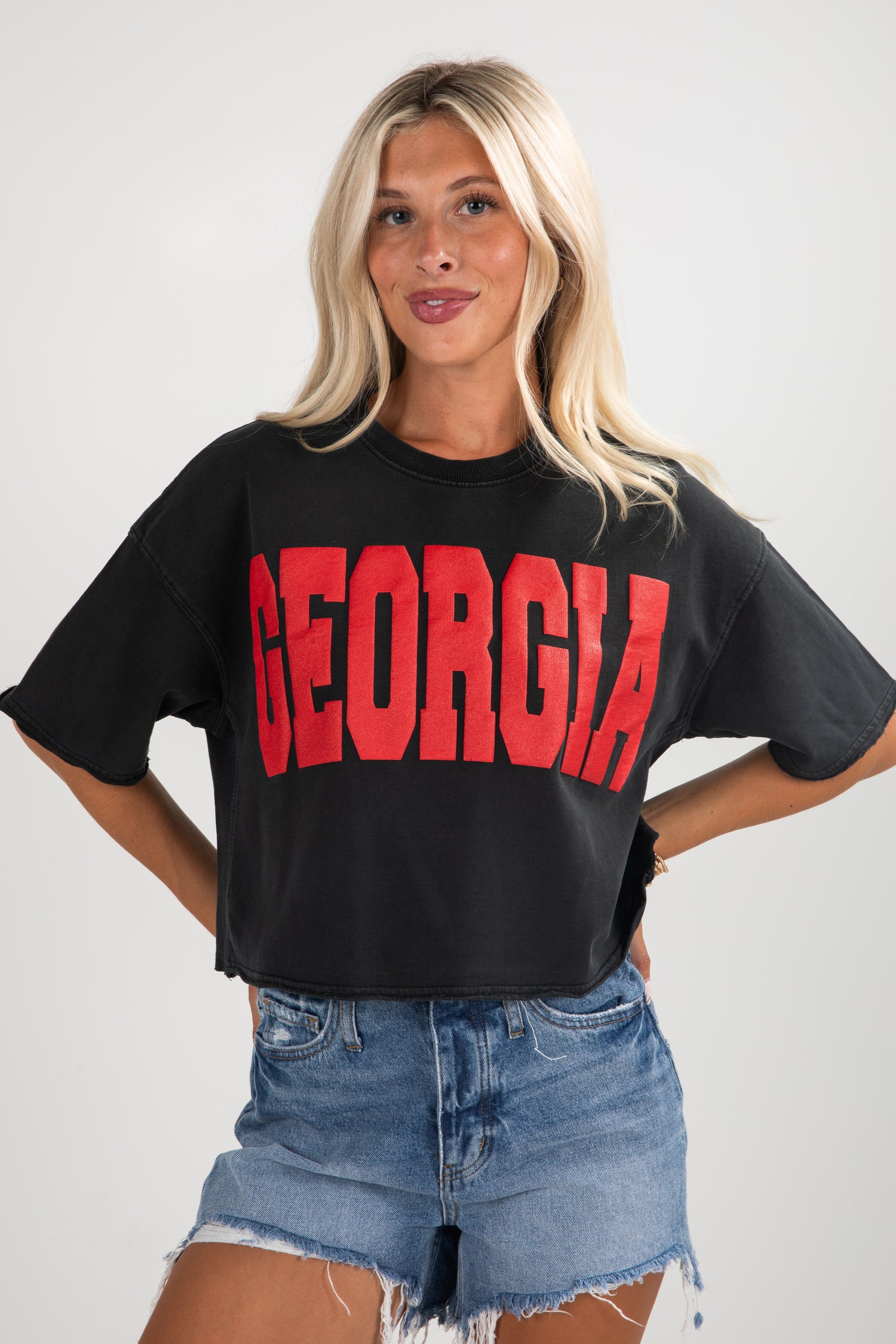 Woman wearing a black t-shirt with &