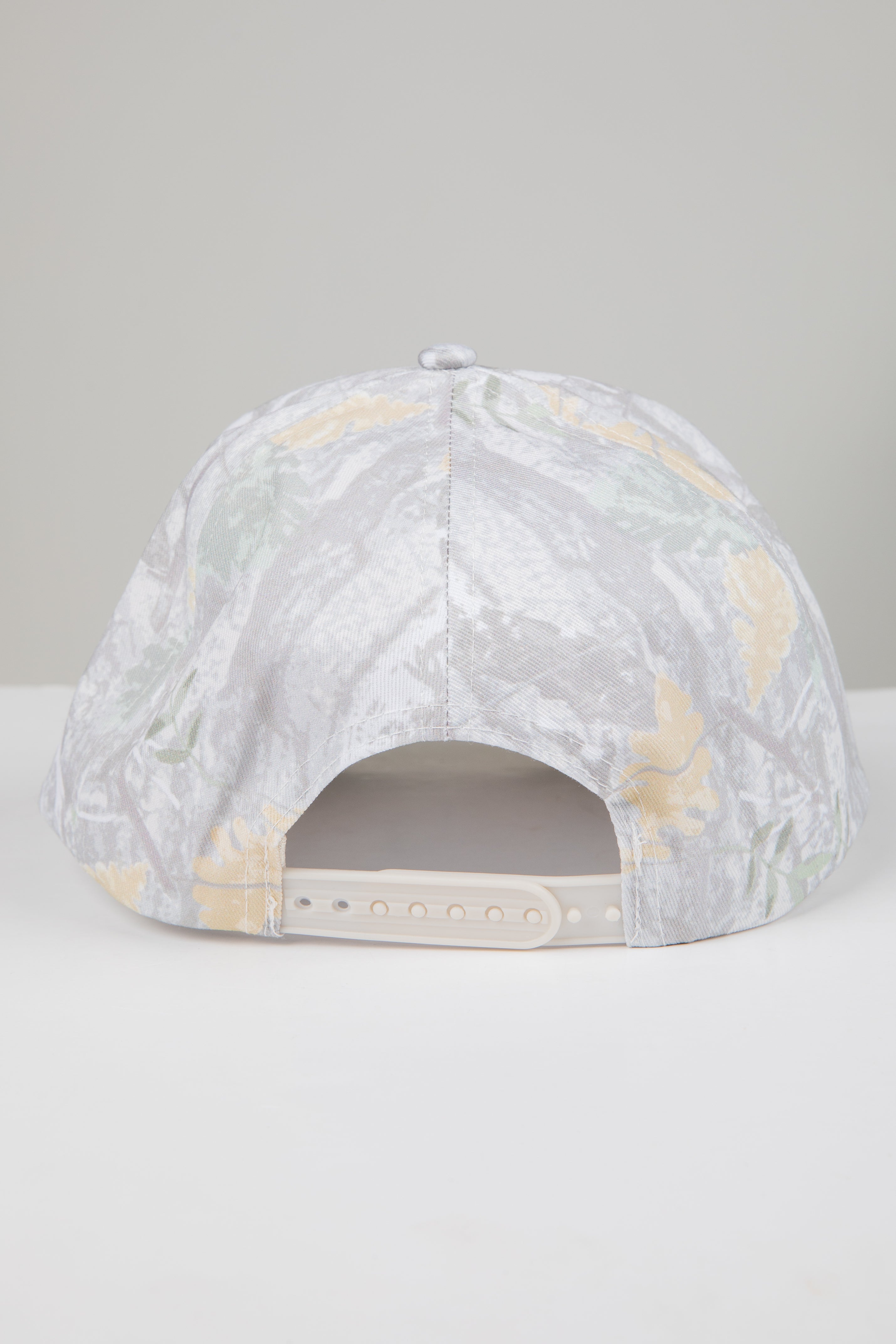 Marbled patterned cap on a light gray background