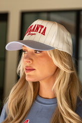 Woman wearing a cap with &