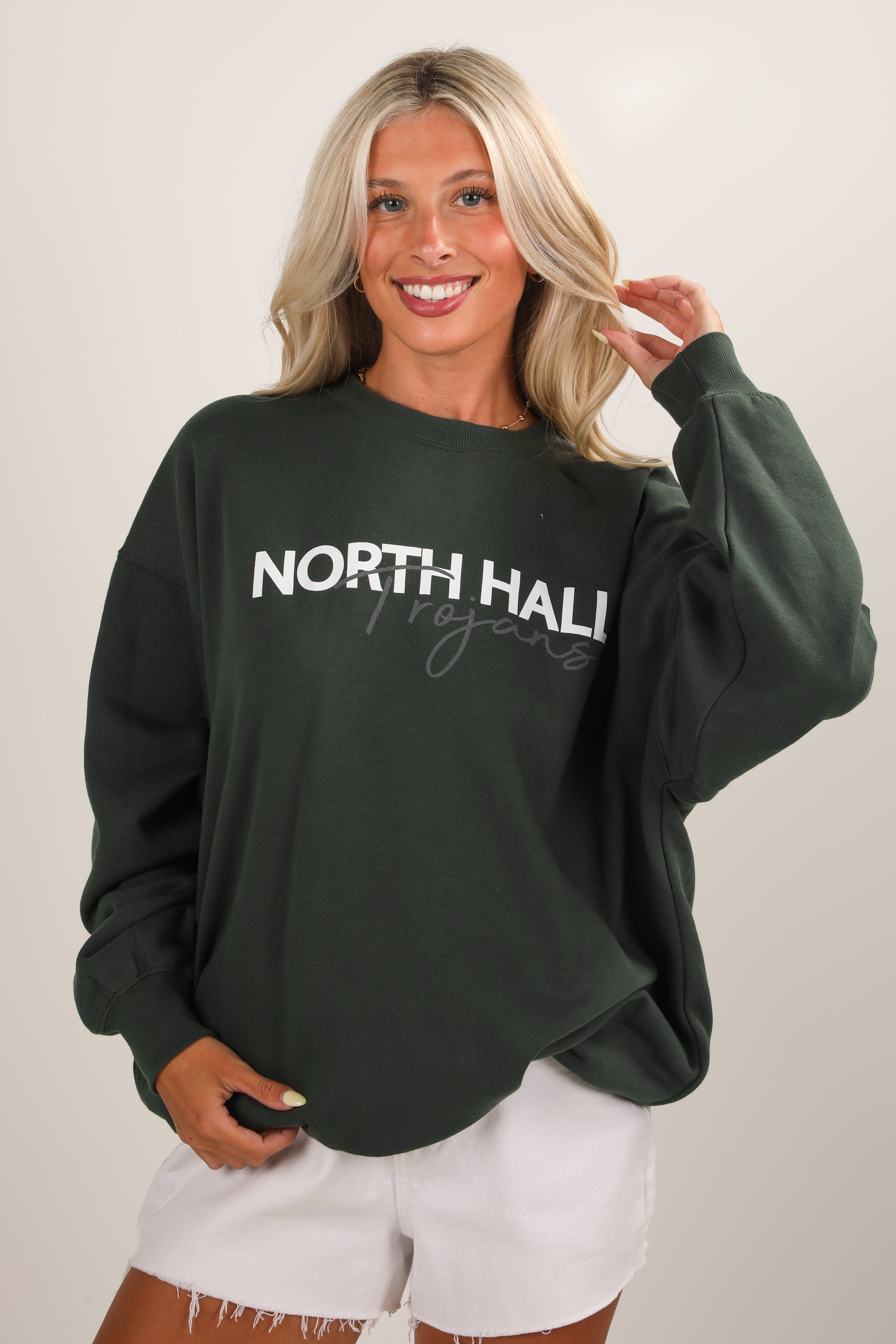 Woman wearing a black sweatshirt with &