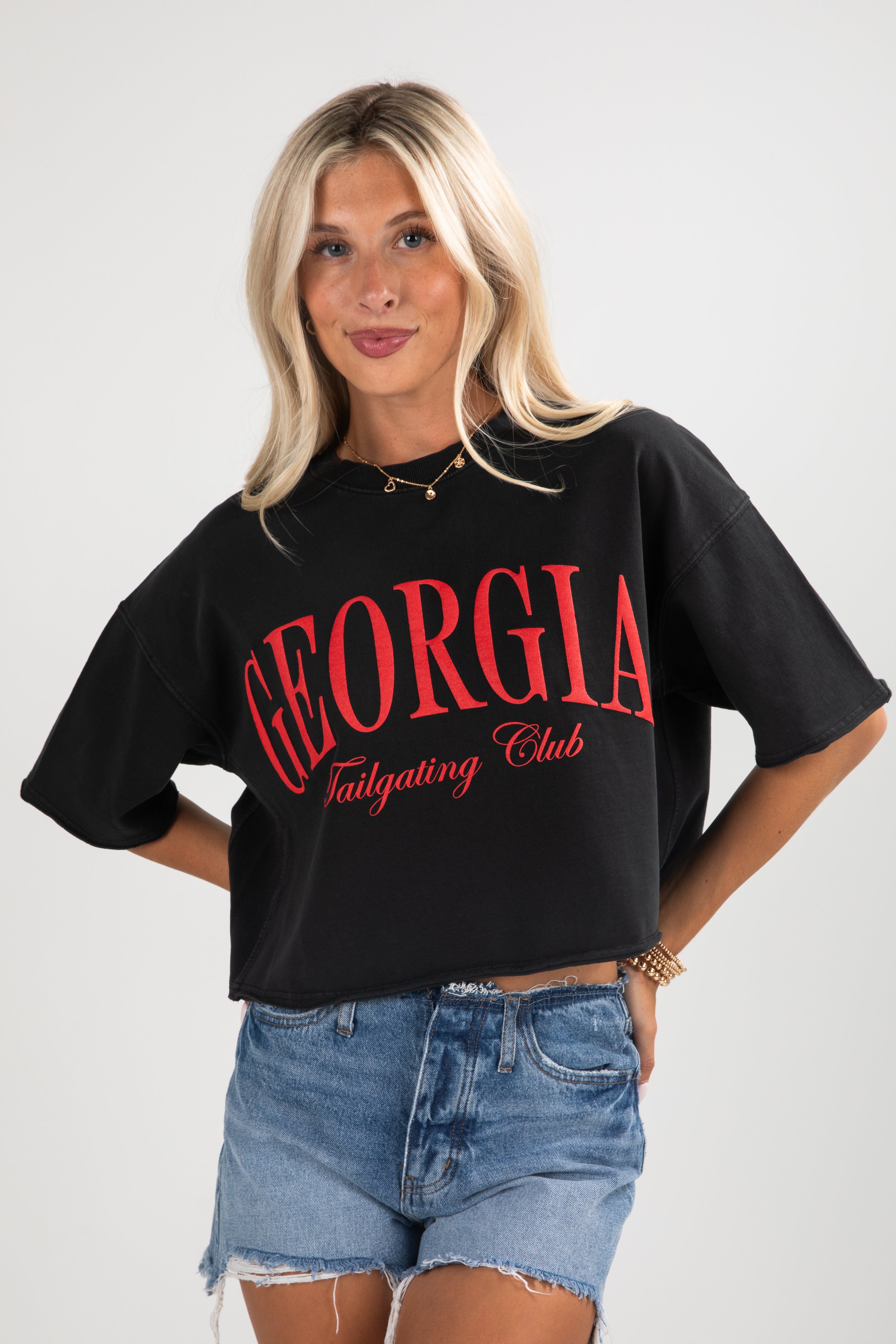 Woman wearing a black t-shirt with &