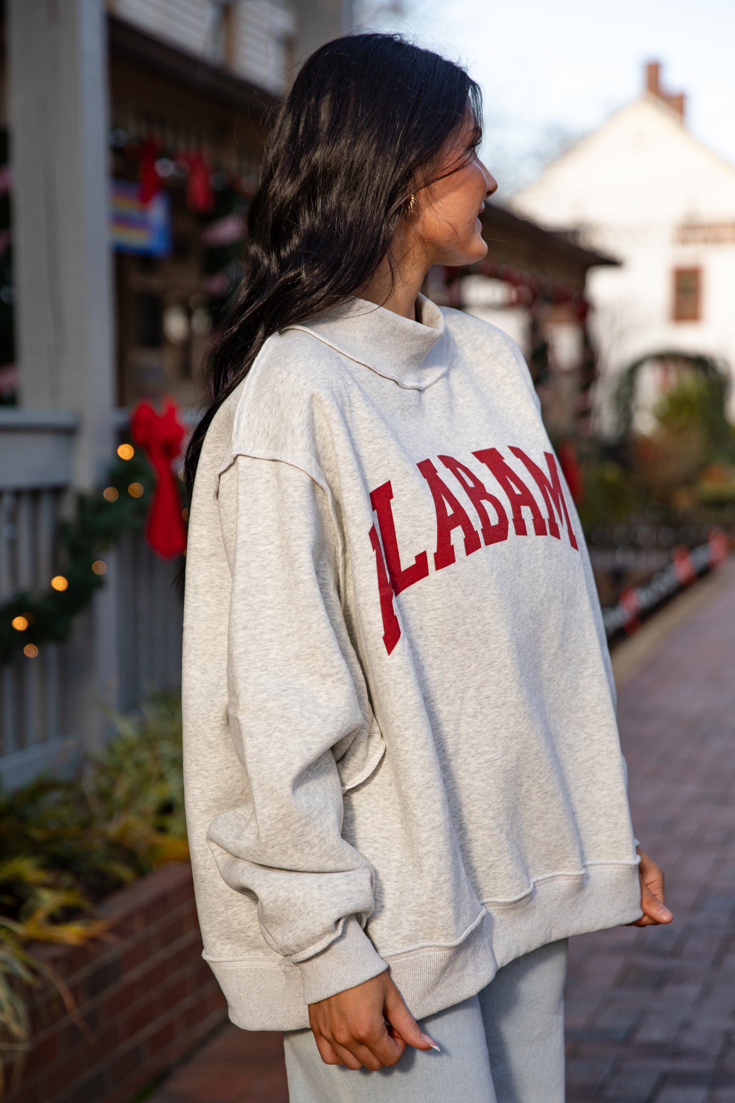 Person wearing a hoodie with &