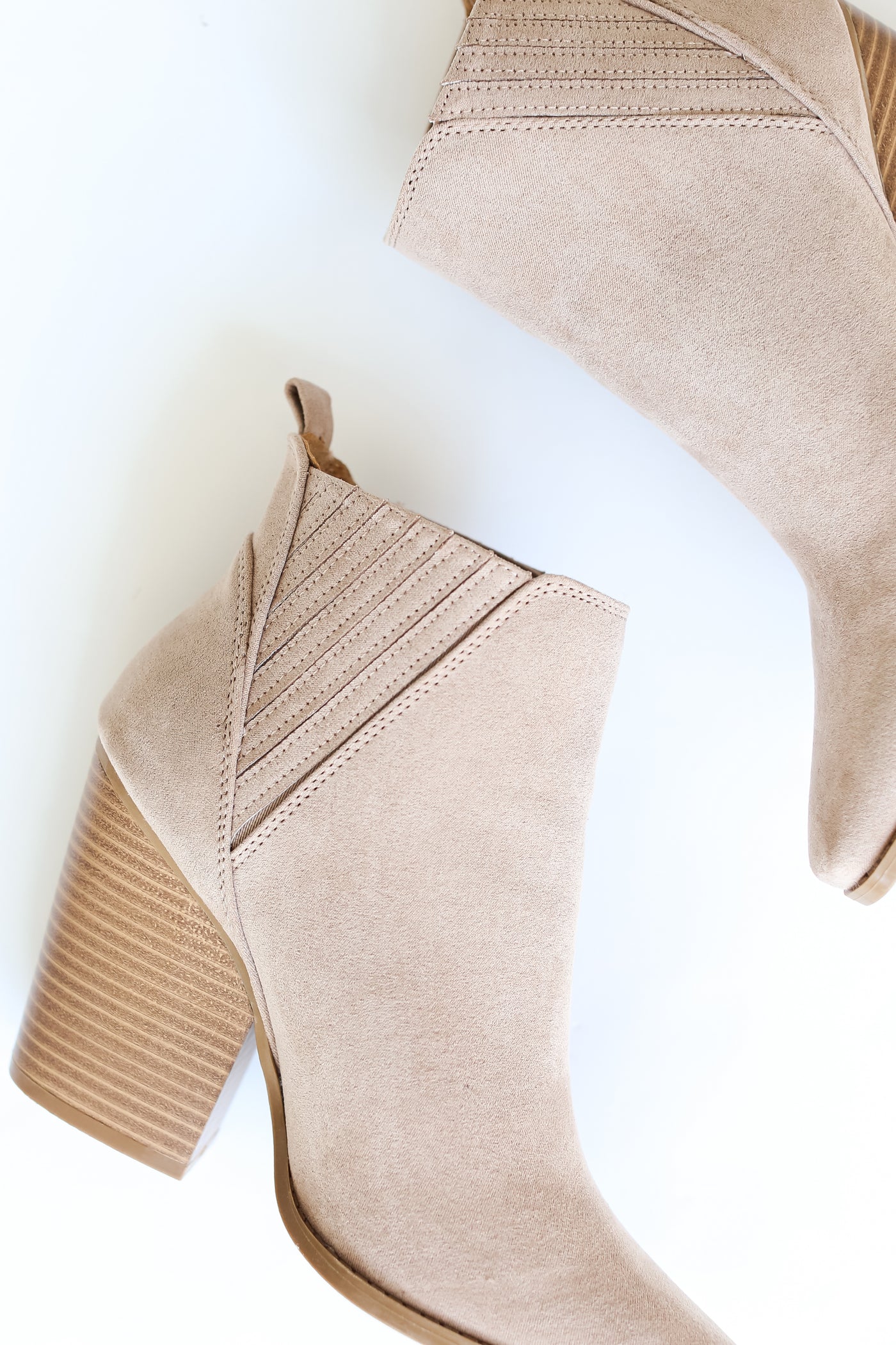 taupe suede Booties close up flat lay