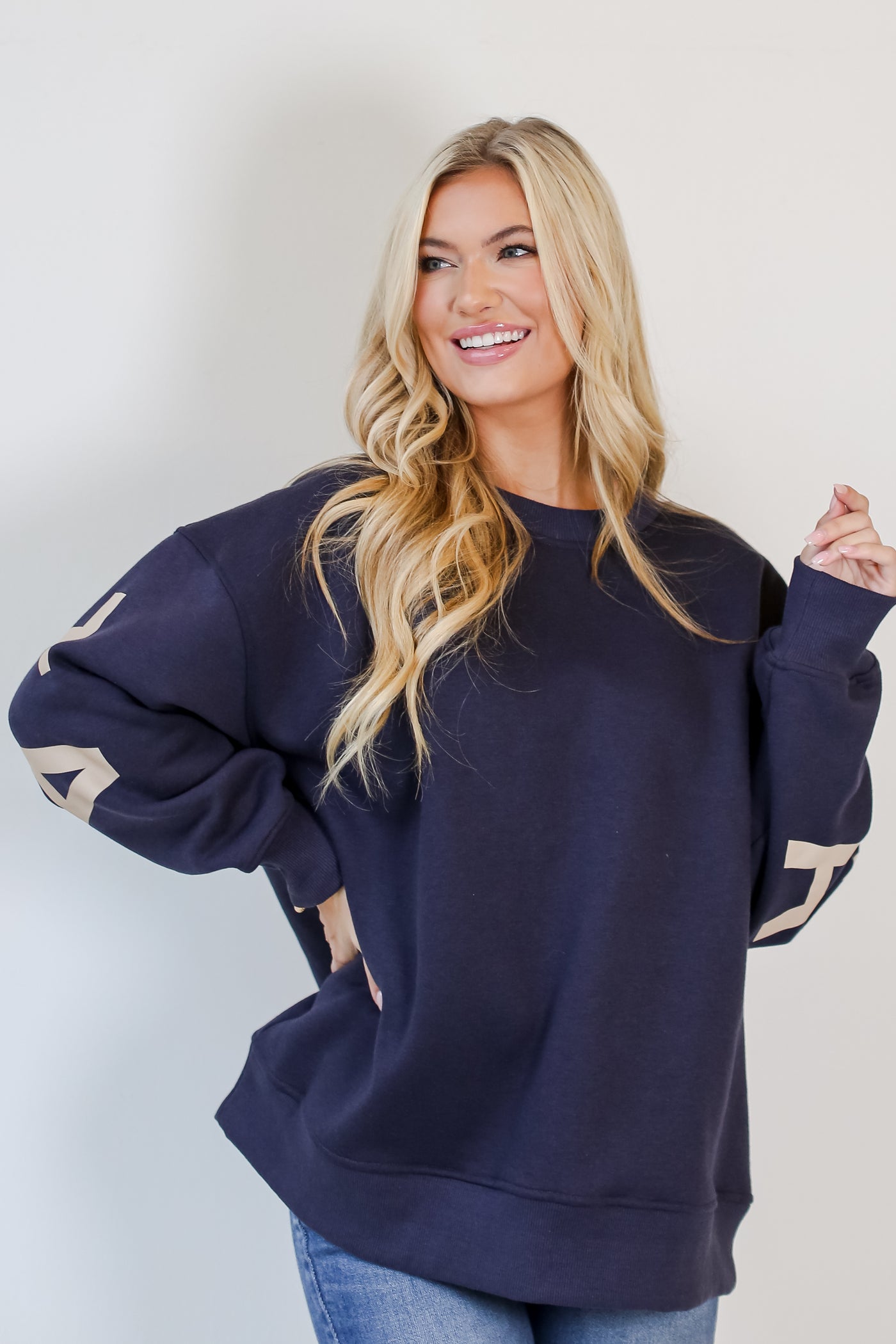 model wearing a fleece navy blue Atlanta Sweatshirt