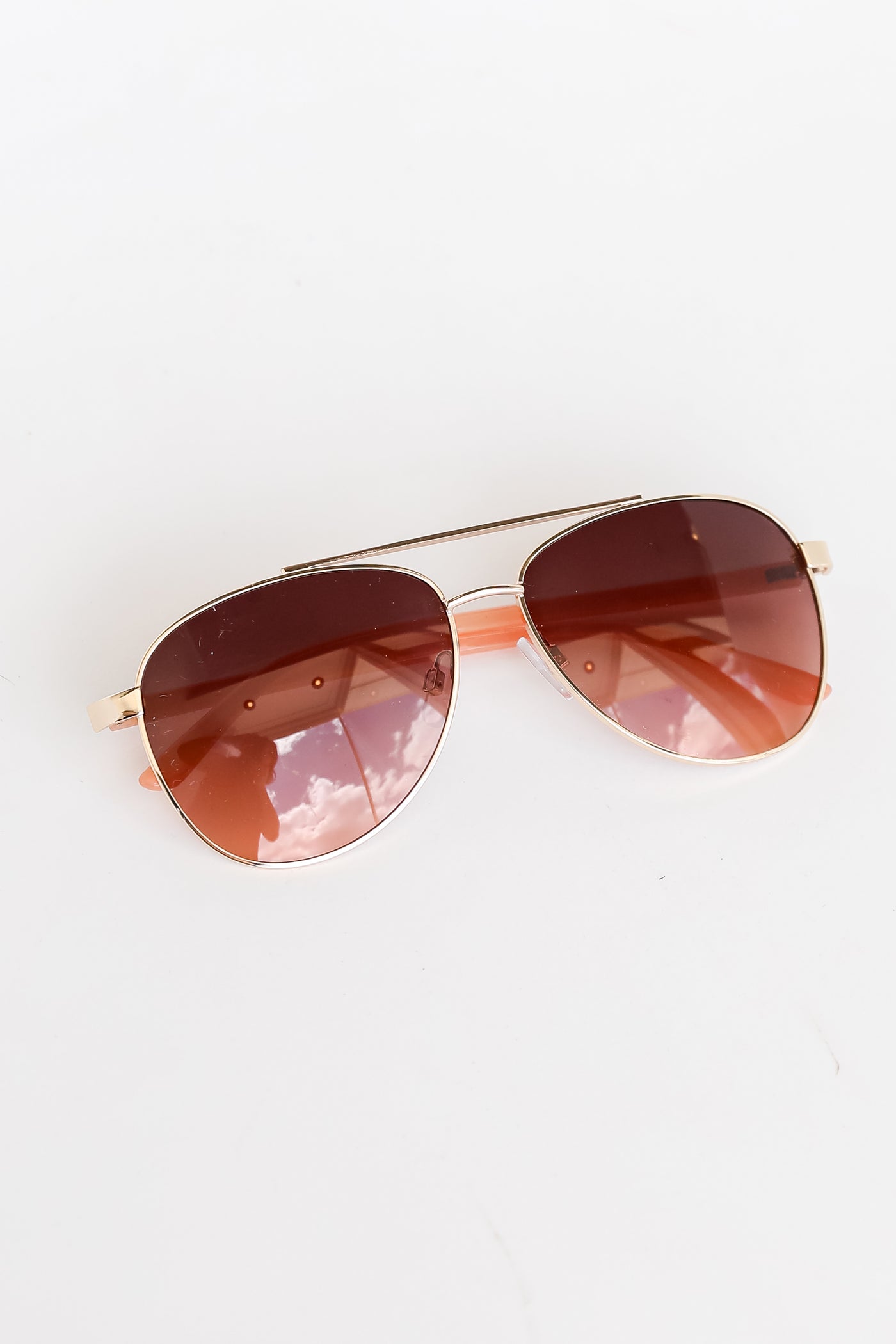 gold Aviator Sunglasses flat lay