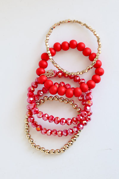 Red + Gold Beaded Bracelet Set flat lay
