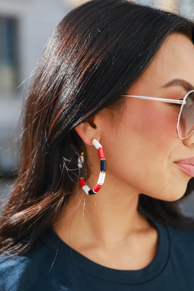 Red + Navy Beaded Hoop Earrings on model