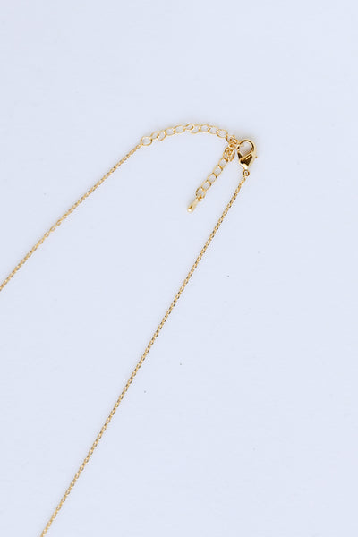 Gold Flower Charm Necklace close up