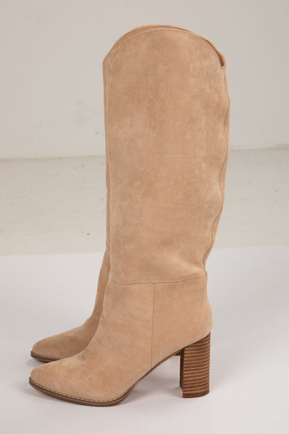 Tan knee-high boot with a brown block heel on a white background