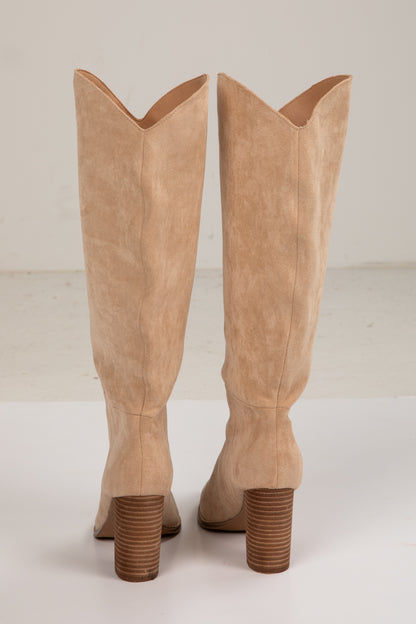 Pair of tan knee-high boots on a white background